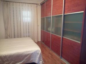 Łóżko lub łóżka w pokoju w obiekcie Apartments Villa Fernetich