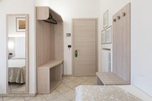 a bathroom with a sink, toilet and cabinets at Hotel Bellavista in Florence