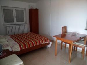 Łóżko lub łóżka w pokoju w obiekcie Apartments Villa Fernetich