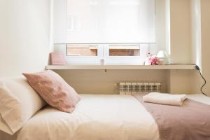 A bed or beds in a room at Granada Home Centro