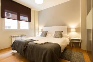 A bed or beds in a room at Granada Home Centro