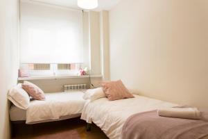 A bed or beds in a room at Granada Home Centro
