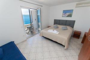 Ένα ή περισσότερα κρεβάτια σε δωμάτιο στο Apartments Matko's Oasis +118 φωτογραφίες