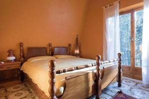 En eller flere senger på et rom på Etnachalet casa vacanze