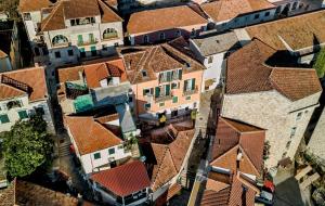 an overhead view of a town with red roofs at Apartments Master 5 in Herceg-Novi