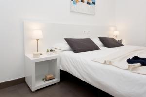 Posteľ alebo postele v izbe v ubytovaní 08028 Apartments