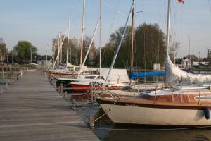a group of boats docked at a dock at Ferienpark Steinhude - Neptun 115 in Wunstorf
