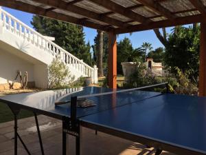 a blue ping pong table on a patio at Apartamento Villa Joya in Benissa