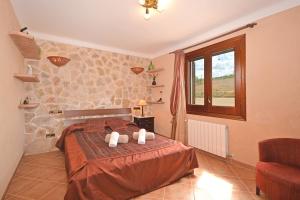 Postel nebo postele na pokoji v ubytování Villa Gamundi