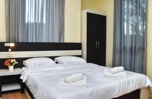 Postel nebo postele na pokoji v ubytování Gelati Tower