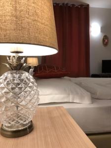 Cama o camas de una habitación en Pietra di Verona Residenza