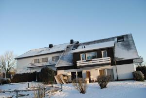 a house in the snow with snow at Landgasthof Gruss in Brilon
