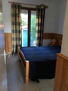 Llit o llits en una habitació de Residence la Catalane
