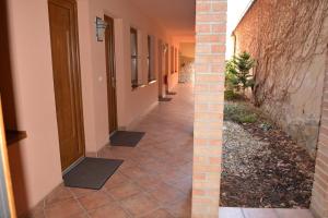 an empty hallway of a building with a door at Penzion na Potočnej in Skalica