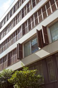 a tall building with brown windows on the side of it at NOA - Sungu 1 in Istanbul