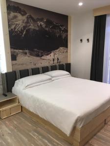 Posteľ alebo postele v izbe v ubytovaní Hotel Paganella Andalo + 33 fotografií