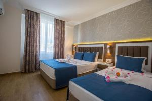 Katil atau katil-katil dalam bilik di Club Big Blue Suit Hotel - All Inclusive