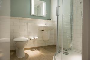 a bathroom with a toilet and a sink and a shower at Balloch House by Innkeeper's Collection in Balloch +20 photos