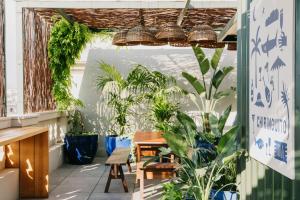 a room filled with lots of plants and a table at Hotel Casa Bonay & Spa in Barcelona
