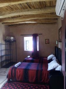 Postel nebo postele na pokoji v ubytování La Kasbah d'Ouzoud