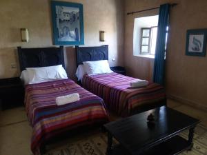 Postel nebo postele na pokoji v ubytování La Kasbah d'Ouzoud