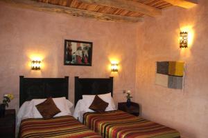 Ένα ή περισσότερα κρεβάτια σε δωμάτιο στο La Kasbah d'Ouzoud