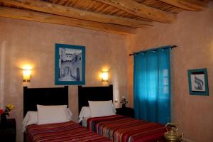 Postel nebo postele na pokoji v ubytování La Kasbah d'Ouzoud