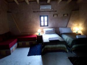 Postel nebo postele na pokoji v ubytování La Kasbah d'Ouzoud