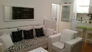 a living room with a couch and two chairs at Apartman -stan u centru in Trebinje