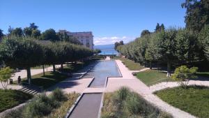 a row of trees and a fountain in a park at Turgot in Thonon-les-Bains