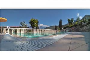 The swimming pool at or close to Appartamenti La Tartufaia Country house pool and relax By Gardadomusmea