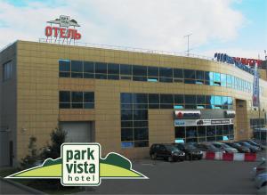 a parking lot in front of a park vista hotel at Park Vista in Yekaterinburg