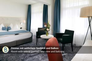 a hotel room with a bed and a chair at Hotel Restaurant Bellevue au Lac in Thun