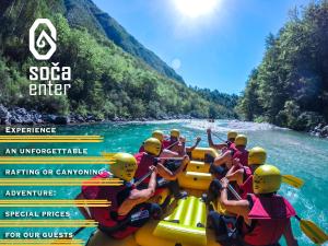 a group of people on a raft on a river at Apartments Kaninska Vas in Bovec