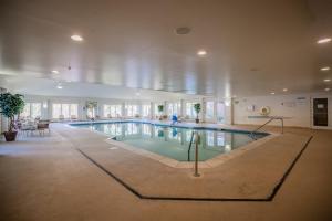 a large swimming pool in a large building at Berkshire Mountain Lodge in Pittsfield