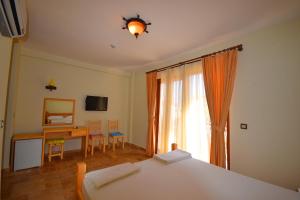 Voodi või voodid majutusasutuse Doada Hotel toas