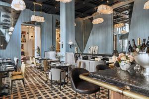 a restaurant with tables and chairs in a room at San Francisco Proper Hotel, a Member of Design Hotels in San Francisco