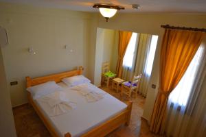 Voodi või voodid majutusasutuse Doada Hotel toas