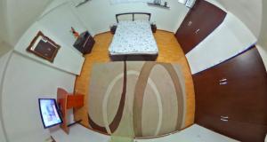 an overhead view of a bedroom with a bed at Csikos Apartment in Cluj-Napoca