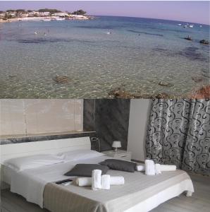 a bedroom with a view of the ocean and a bed at Summer Beach Rooms in Fontane Bianche