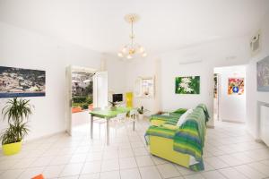 a living room with a couch and a table at Villa Laura amazing breakfast,private outdoor hot tub, Positano experience in Positano