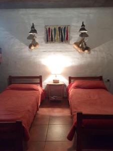 A bed or beds in a room at La Chacrita