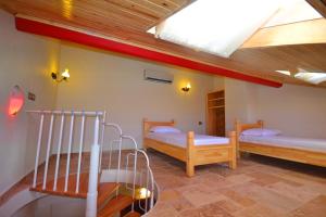 Voodi või voodid majutusasutuse Doada Hotel toas