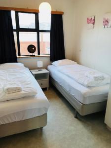 Postel nebo postele na pokoji v ubytování Óseyri Farmhouse