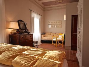 A bed or beds in a room at Agriturismo Il Ponticello