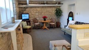 a living room with a table and chairs at Alexander Mansion Bed & Breakfast in Winona