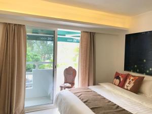 Ένα ή περισσότερα κρεβάτια σε δωμάτιο στο Bellagio Pets Friendly Resort