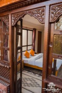 a bedroom with a bed with an open door at Dhulikhel boutique hotel in Dhulikhel