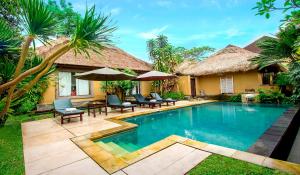 a villa with a swimming pool in a resort at The Sungu Resort & Spa in Ubud