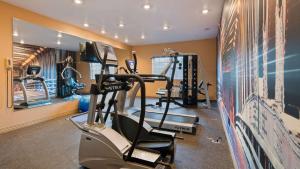 a gym with two tread machines and a treadmill at Best Western Manhattan Inn in Manhattan